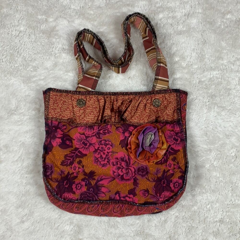 Handmade floral bag with‎ fabric flower and metal accents